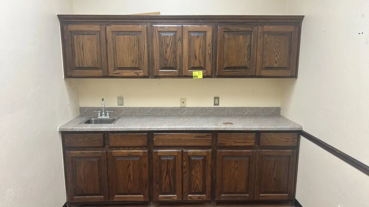 8' kitchen cabinet and countertop suite. Includes 8'L laminate countertop with single-basin stainless steel drop-in sink and faucet, 8'L upper wall ca