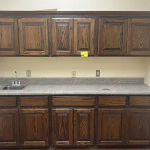 8' kitchen cabinet and countertop suite. Includes 8'L laminate countertop with single-basin stainless steel drop-in sink and faucet, 8'L upper wall ca