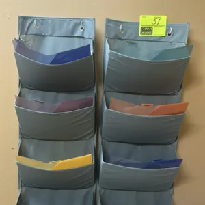 Multi-tier fabric wall-hanging organizers. Includes (2) 4-pocket hanging organizers with metal grommets. Contents not included.
