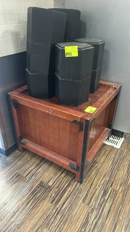Wooden produce dump display bin. Features wood construction with dark metal corner bracket reinforcements and vertical slat styling. Dimensions: 3'L.