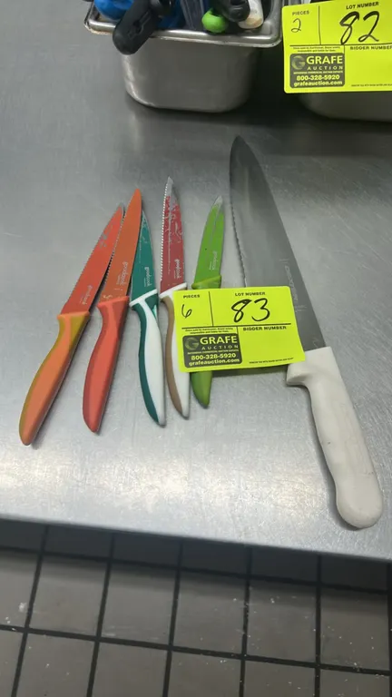 GoodCook and Dexter kitchen knives. Includes (1) Dexter knife with textured white molded handle and (5) GoodCook assorted color-coated prep and utilit