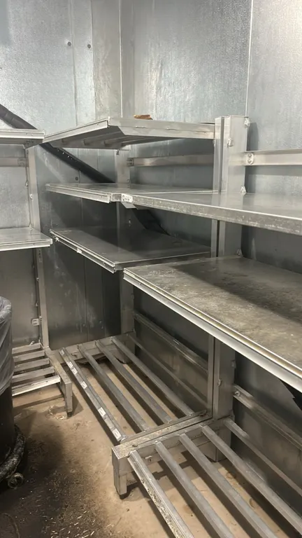 4'L aluminum cantilever racks. Features welded aluminum construction, solid cantilever upper shelves, and bottom slatted dunnage base shelves. Trash c