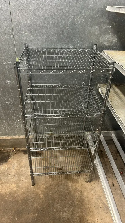 Stainless steel 4-tier wire shelving rack. Features four adjustable wire shelves. 24" x 20".