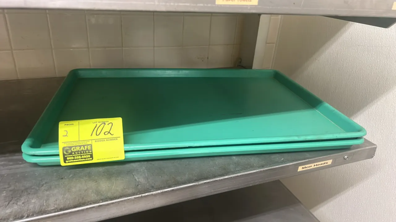 Full-size poly display trays. Features green molded plastic construction with raised edges.