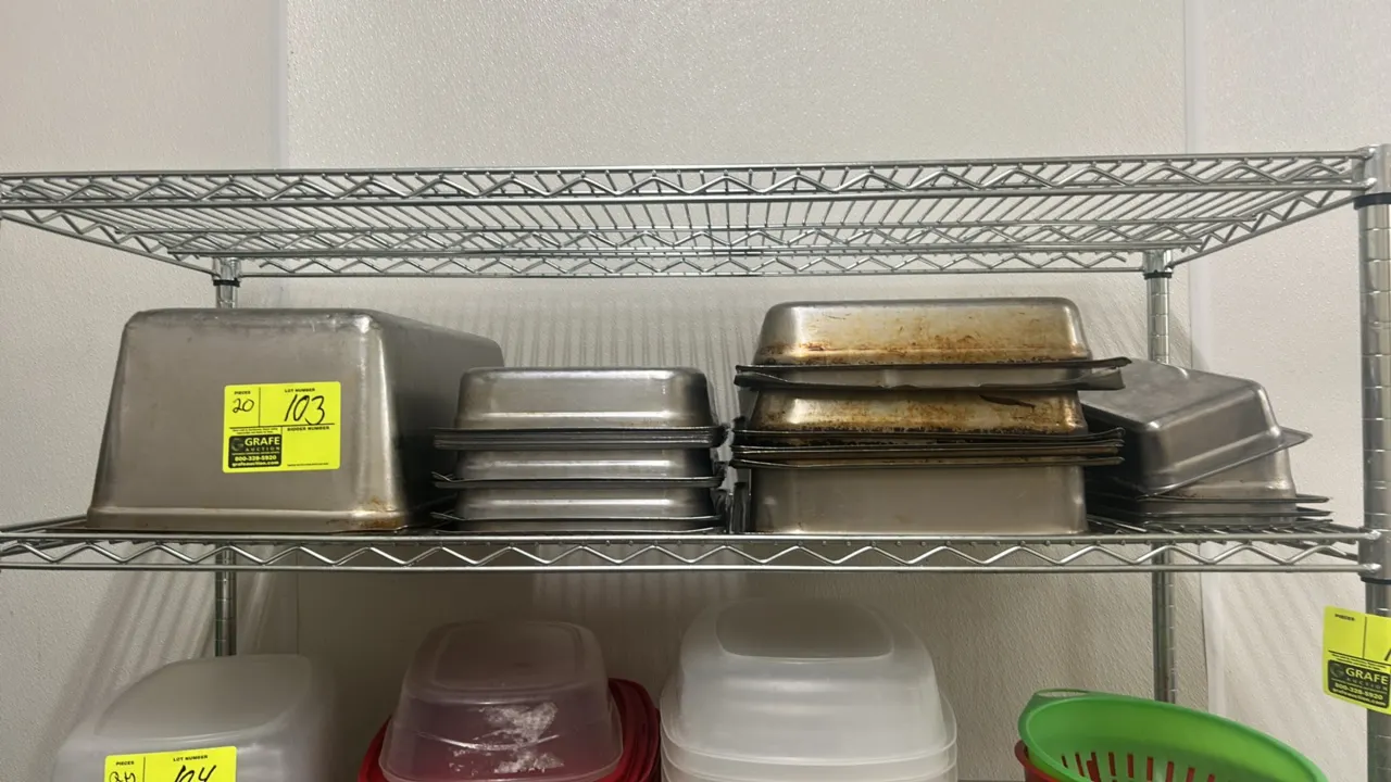 Assorted stainless steel insert pans. Features various standard fractional and full sizes with assorted depths. Stainless steel construction. Shelving
