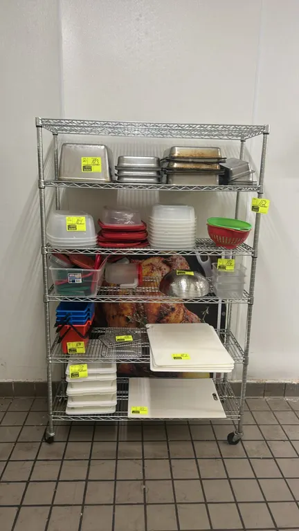 5-tier chrome wire shelving rack. Features adjustable wire shelves. 48"W x 18"D. Mounted on casters. Contents not included.