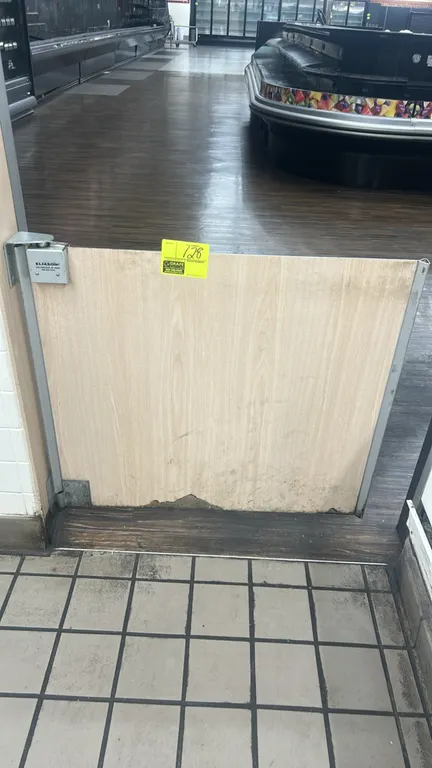 Eliason swing gate door. Features woodgrain laminate finish, metal edge trim, and Eliason swing hinge hardware. 3'W. Note: Bottom edge has laminate da