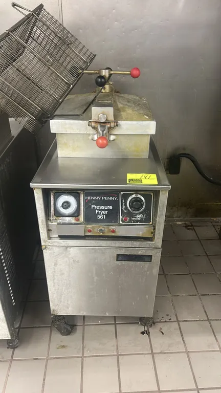 Henny Penny 561 stainless steel commercial electric pressure fryer. Features mechanical timer, analog temperature control dial, locking lid assembly,