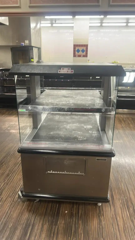 Custom Deli's Equipment 2-tier portable hot food merchandiser. Features stainless steel construction, heated display decks, glass side panels, and pro