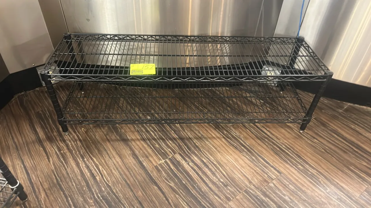 Metal wire racks. Features 2-tier black wire construction with adjustable leveling feet. Dimensions: 48"W x 14"D.