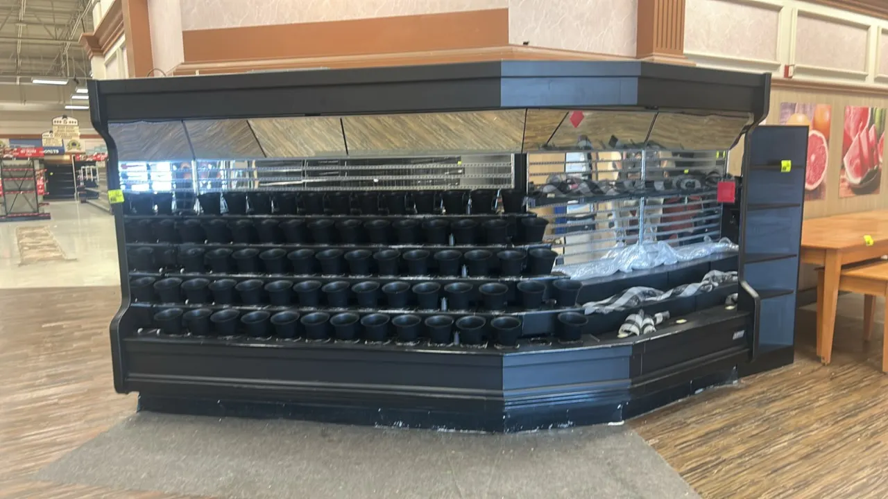 Floraline medium-temp multi-tier floral display cases. Features tiered vase display holders, mirrored interior backing, upper mirrored canopy, and bla
