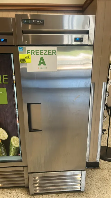 True T-23F-HC single-door reach-in freezer. Features stainless steel construction, digital temperature display, and adjustable wire shelving. Self-con