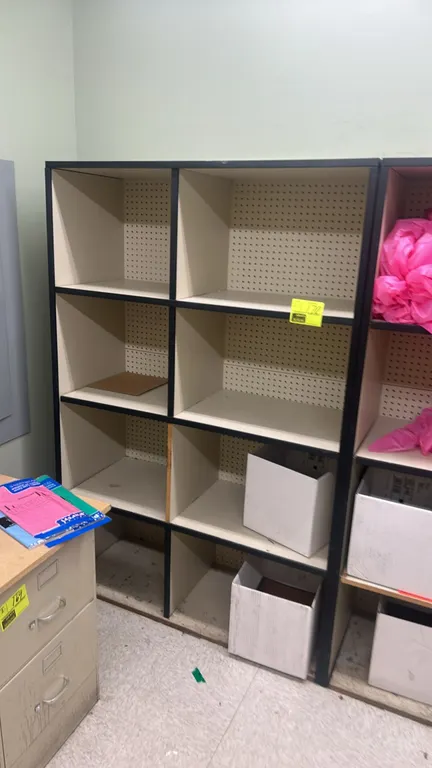 Laminate multi-tier cubby shelving units. Features 8 storage compartments per unit and pegboard backing with black trim. Dimensions: 48"W x 18"D each.
