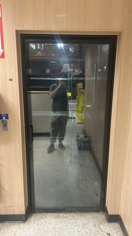 Foam panel floral walk-in cooler. Features (3) Tyler glass display doors, single personnel access door, Kramer 3-fan evaporator coil, and interior flu