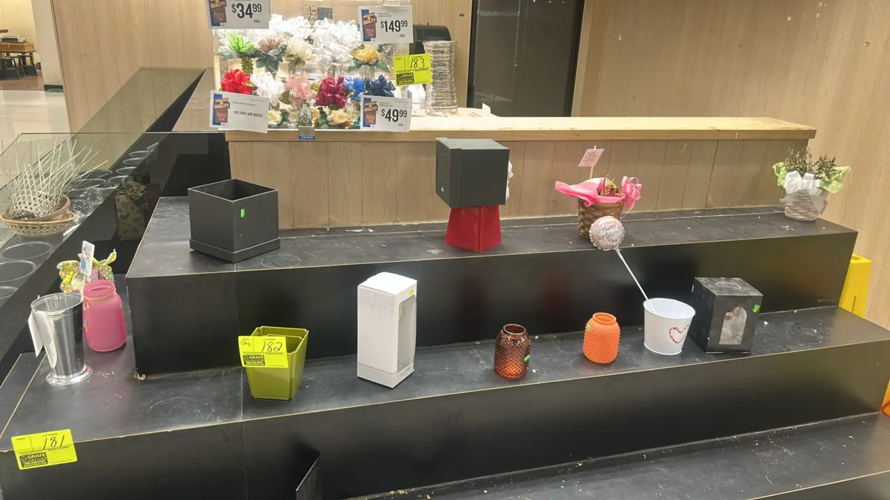 Assorted floral baskets, vases, and decorative containers. Includes glass vases, decorative jars, woven baskets, small planters, and gift boxes in var