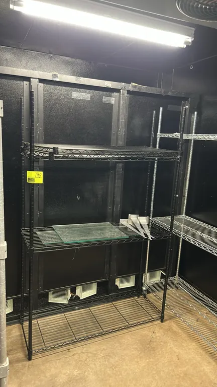 3-tier metal wire shelving rack. Features black wire construction with (3) wire shelves. 48" x 20". Contents on shelves not included.