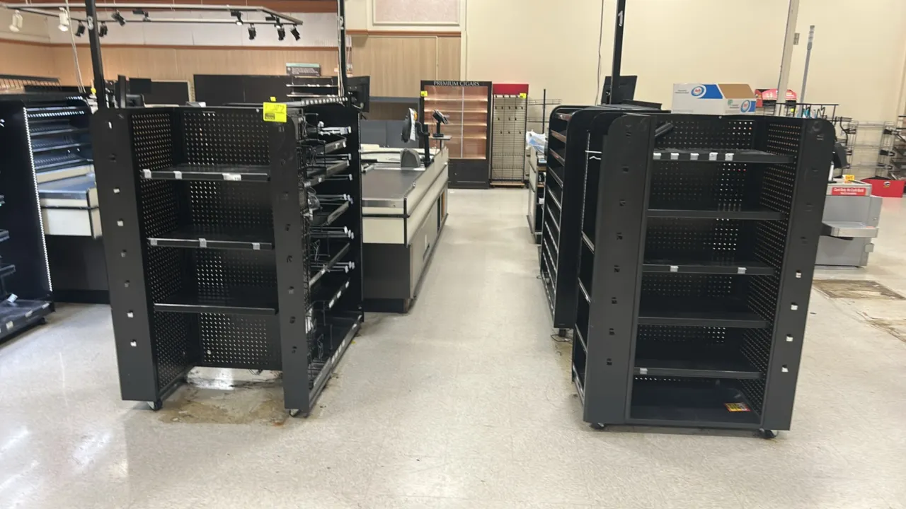 Metal portable 3-sided candy and magazine display racks. Features black metal construction with pegboard backing, adjustable shelves, wire display rac