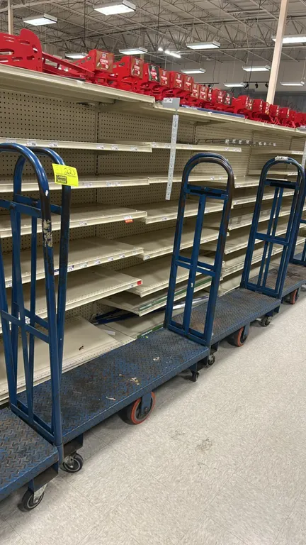 Metal U-boat platform carts. Features blue steel diamond plate decks and tall tubular end handles. 4'L. Mounted on corner swivel casters and rigid cen