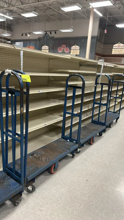 Metal U-boat stocking carts. Features steel diamond plate decks and tall tubular end handles. 4'L. Mounted on center rigid wheels and corner swivel ca