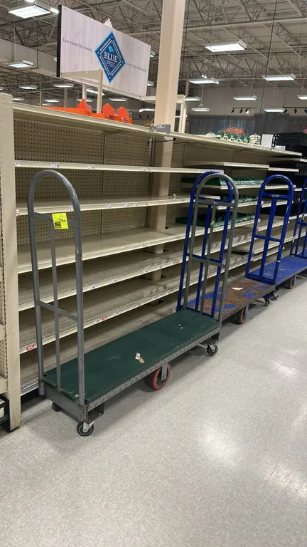 Metal U-boat stocking carts. Features diamond-plate deck construction and dual tall tubular end handles. 5'L. Mounted on rigid center wheels with swiv