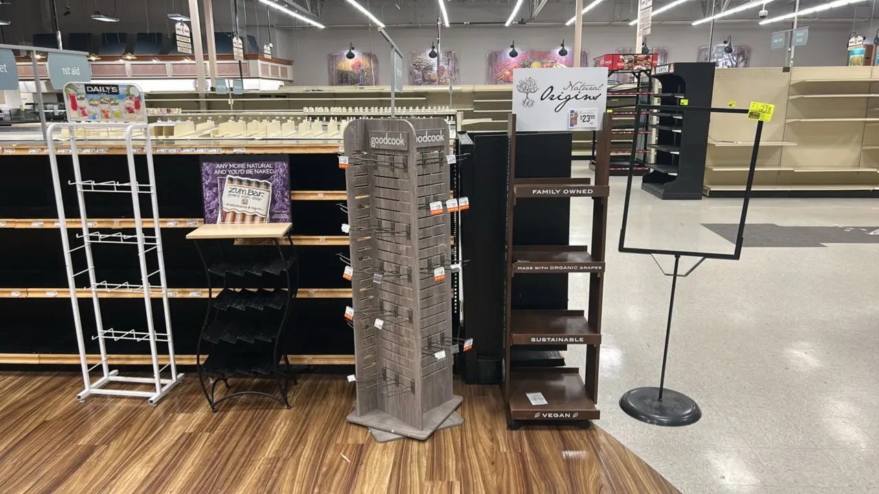 Assorted retail merchandisers and sign stand. Includes (1) 24" metal floor sign stand on round base, (1) 4-tier mobile laminate display shelf on caste