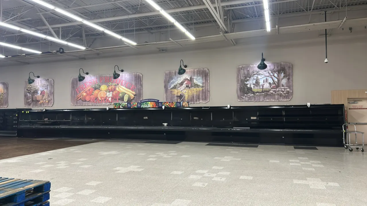 1999 Tyler L4M12 3-tier open produce display cases. Features solid adjustable shelving, canopy lighting, and top-mounted roll bag dispensers. Dimensio