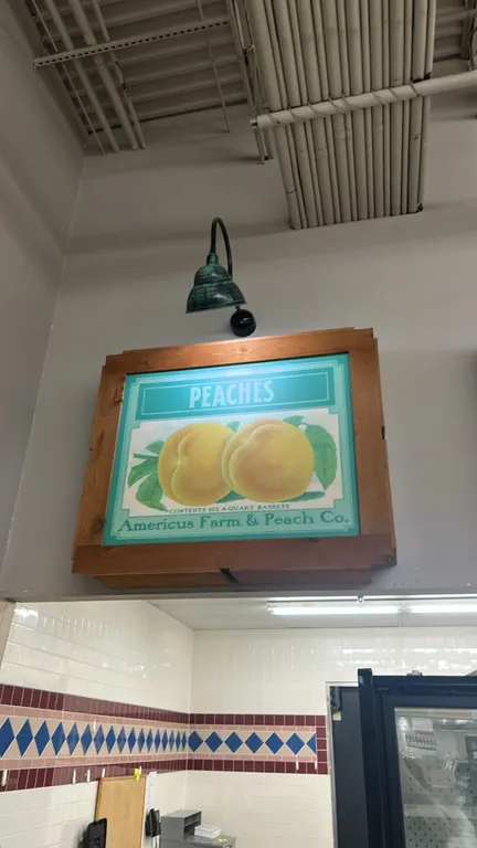 Produce-themed framed wall decor signs. Features vintage-style fruit and vegetable crate label artwork set in rustic wooden crate-style box frames. In