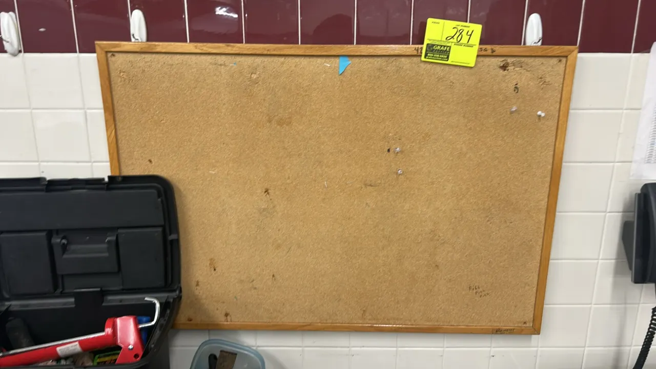 Quartet cork bulletin board. Features a cork tack surface and a natural wood frame. 3' x 2'.
