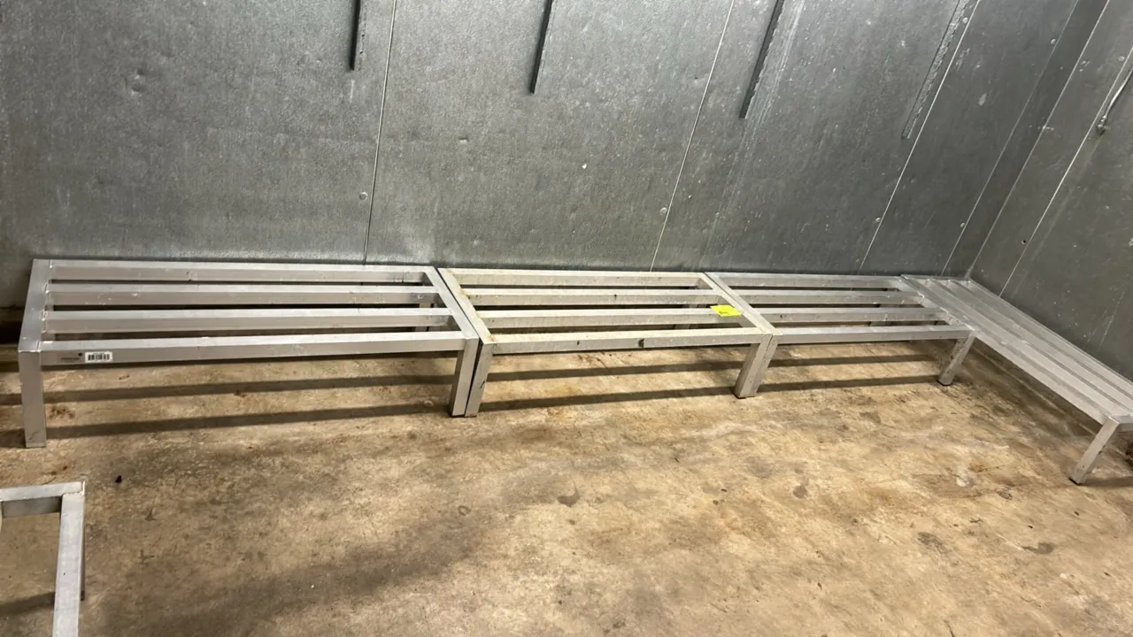 Metal dunnage racks. Features welded tubular aluminum construction with slatted tops. 4'L each.
