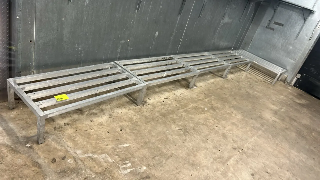 Metal dunnage racks. Features welded tubular construction with a slatted top design. 4'L each.