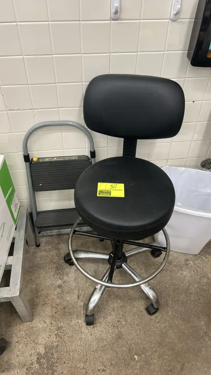 Rolling drafting stool and Cosco 2-step folding step stool lot. Drafting stool features black vinyl cushioned seat and backrest, adjustable height, ch