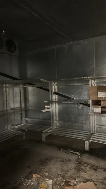 Metal storage racks. Features multi-tier design with tubular base shelving and adjustable upper shelves. 4'L each. Contents not included.