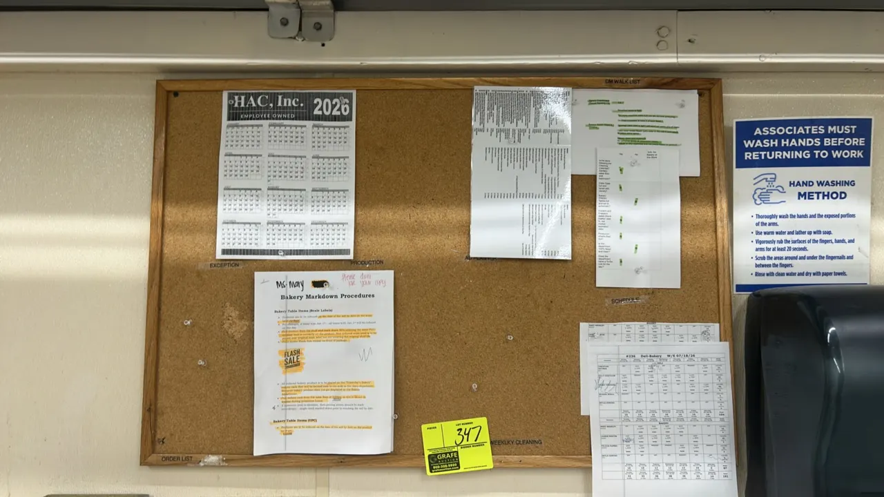 Cork bulletin board. Features a wood frame. 3' x 2'. Wall mounted. Contents not included.