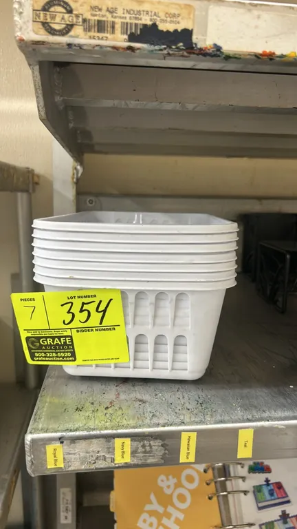 Poly storage baskets. Features white plastic construction with slotted ventilation sides and stackable design.