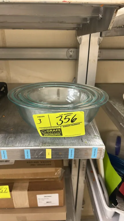 Assorted glass mixing bowls. Features nested clear glass construction in graduated sizes.