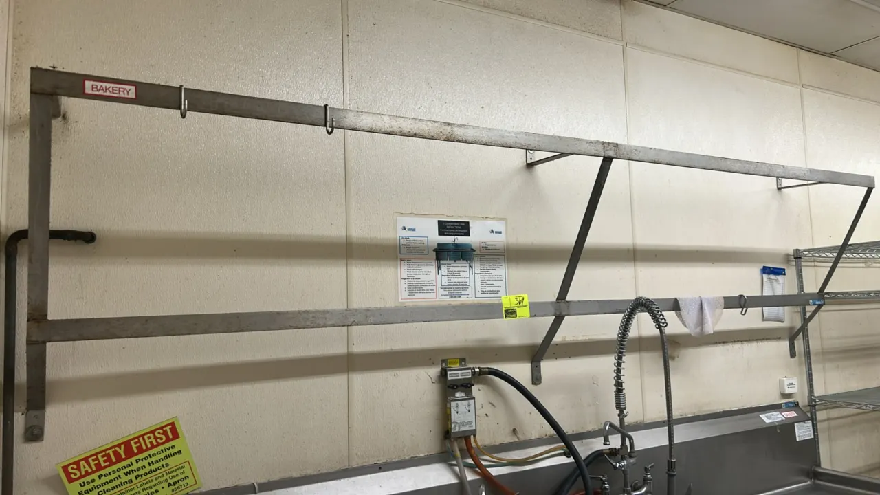 Stainless steel utensil drying rack. Features 2-tier bar design with wall mounting brackets and hanging hooks. 10'L. Wall mounted. Sink and surroundin