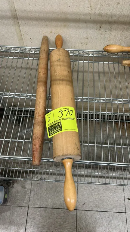 Wooden rolling pins. Solid wood construction. Includes (1) traditional rolling pin with turned handles and (1) straight rolling dowel.