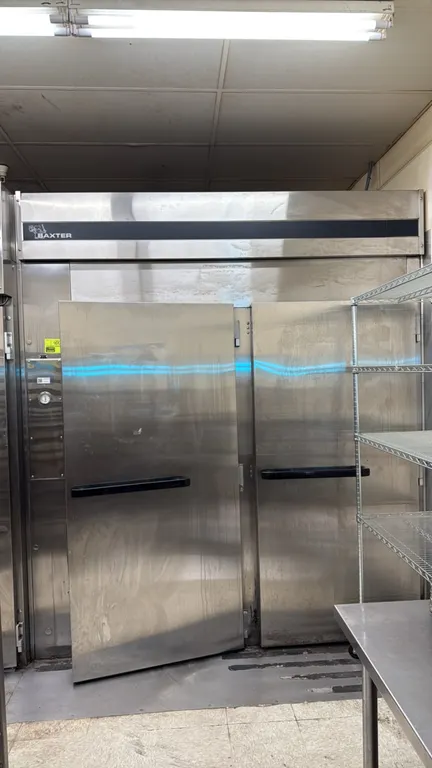 Baxter stainless steel 2-door roll-in rack refrigerator/retarder. Features stainless steel construction, 2 solid hinged doors, exterior temperature ga