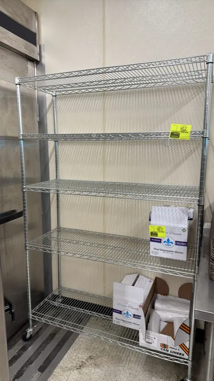 Seville Classics 5-tier mobile wire shelving rack. Features chrome finish, 5 adjustable wire shelves, and NSF certification. Dimensions: 48"W x 18"D x
