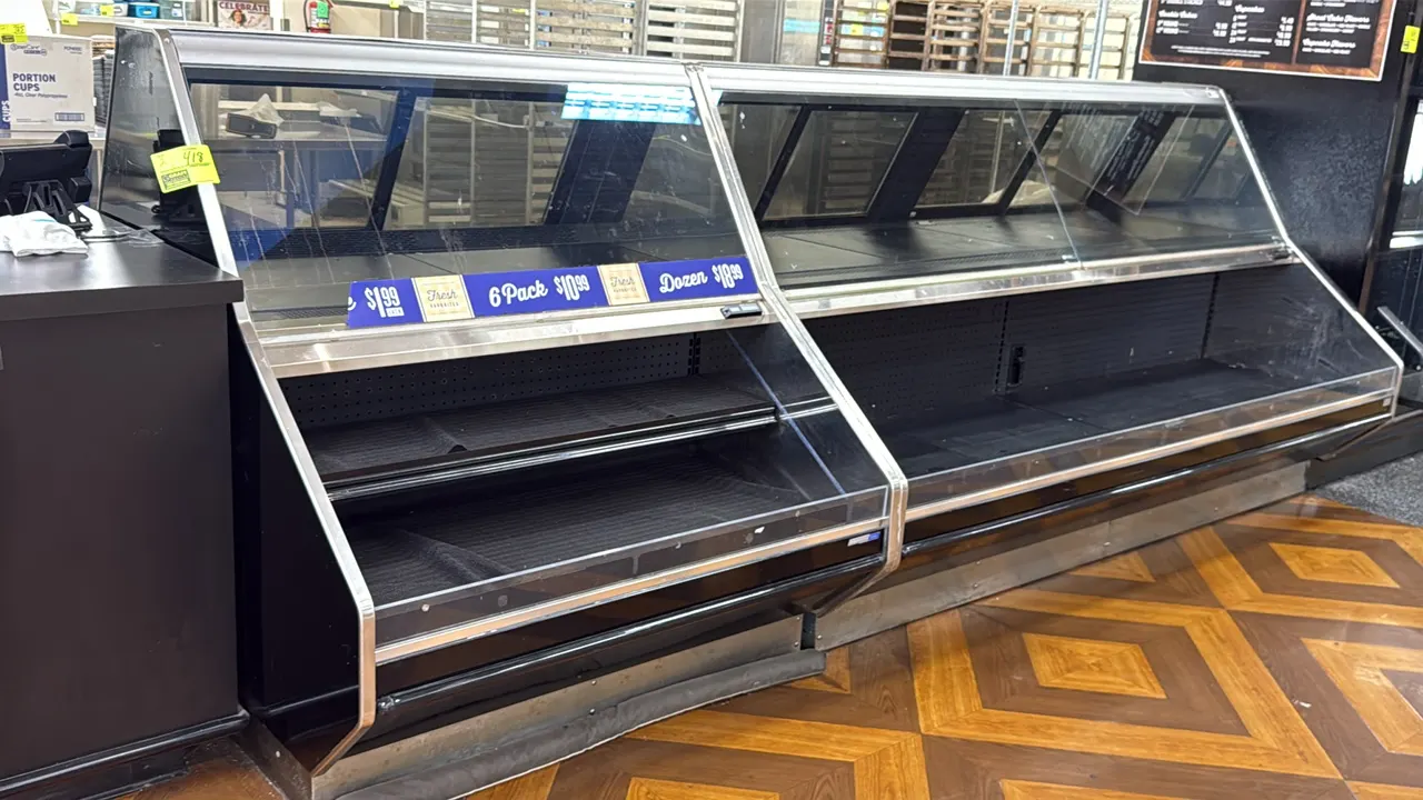 2012 Barker refrigerated bakery service cases. Features slanted front glass, rear sliding access doors, lower refrigerated self-serve front deck, and