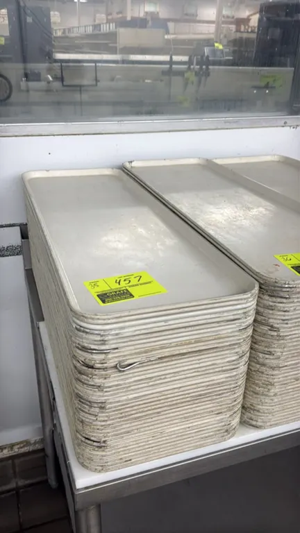 Poly meat display platters. Features white molded poly construction with raised rim edges. Dimensions: 10.5" x 30".