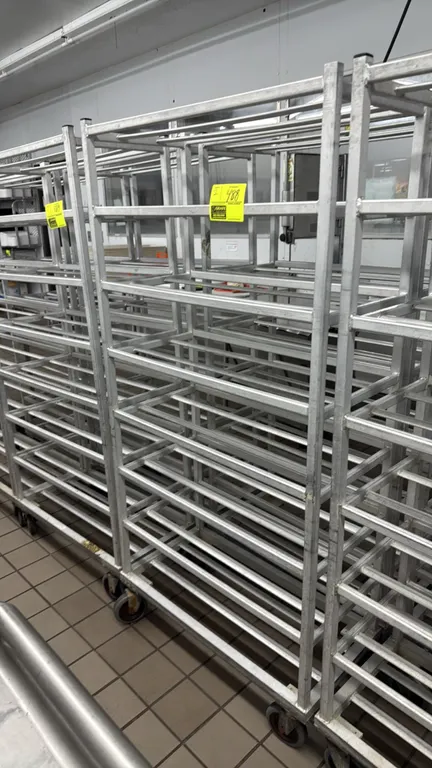 Aluminum mobile meat platter racks. Features all-welded aluminum construction and multi-tier platter runners. Mounted on swivel casters.