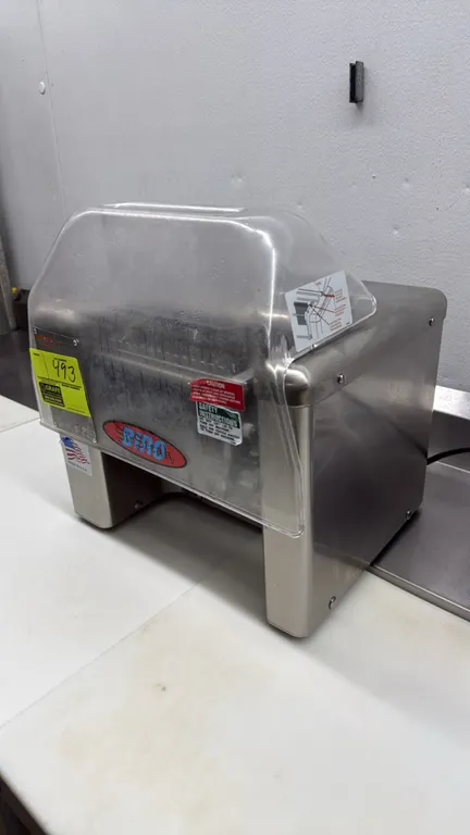 Biro SirSteak meat tenderizer and cuber. Features stainless steel housing, clear flip-up safety guard with top feed chute, and removable stainless ste