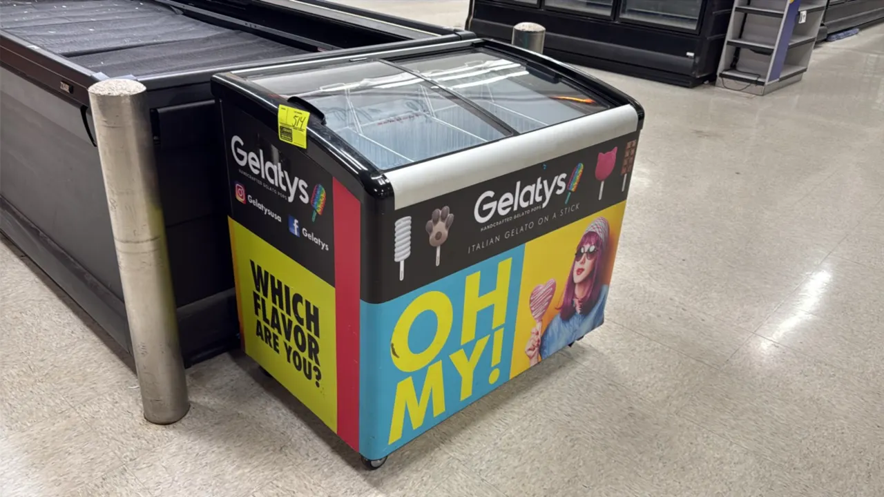 Portable self-contained spot freezer. Features curved sliding glass top lids, interior wire dividers, and colorful promotional graphics. 40"W. Mounted