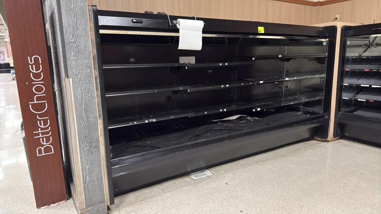 1999 Tyler L5MG12 multi-deck meat display case. Features slanted top mirrors, multi-tier adjustable shelving, and interior canopy lighting. 12'L. Note