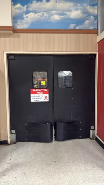 Poly impact swing doors. Features black polyethylene construction, viewing windows, lower impact bumpers, and mounting hardware. 40"W x 82"H.