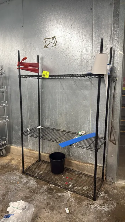 Protrend wire shelving rack. Features black finish and (3) adjustable wire shelves. 48" x 18" x 74". Contents not included.