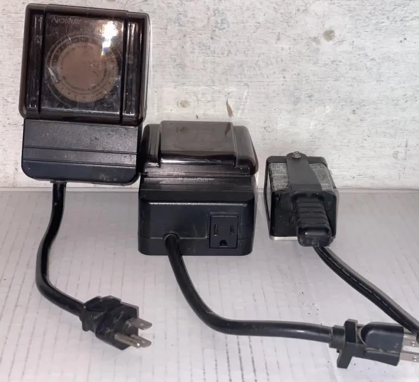 Two SaskPower outdoor timers and a magnetic block
