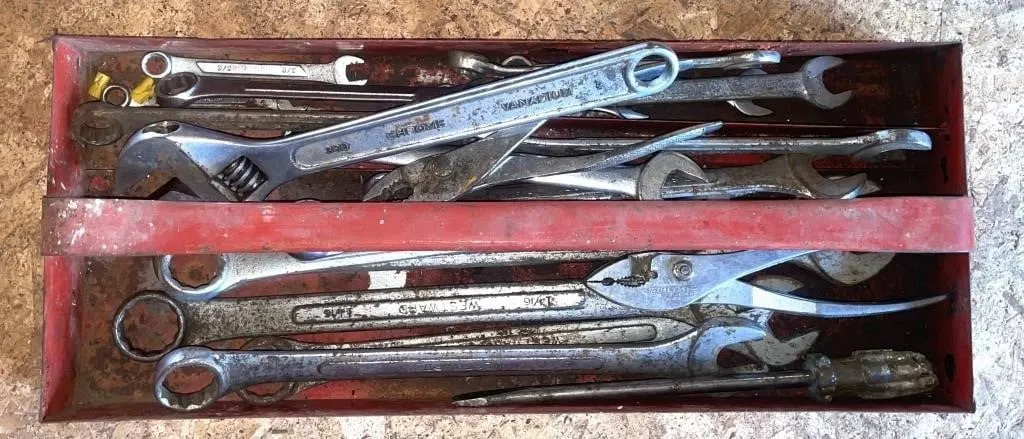 Tray with pliers, wrenches, and more.