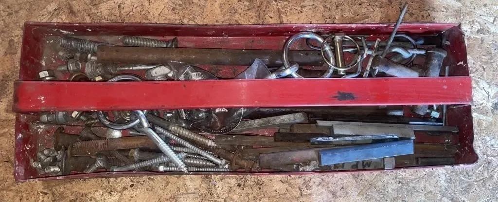 Tray with assorted hardware. Includes lag screws,